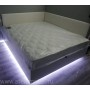 Кровать в спальню на подиуме с подсветкой, с подъемом и бельевым ящиком